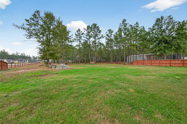 a view of outdoor space with deck and yard