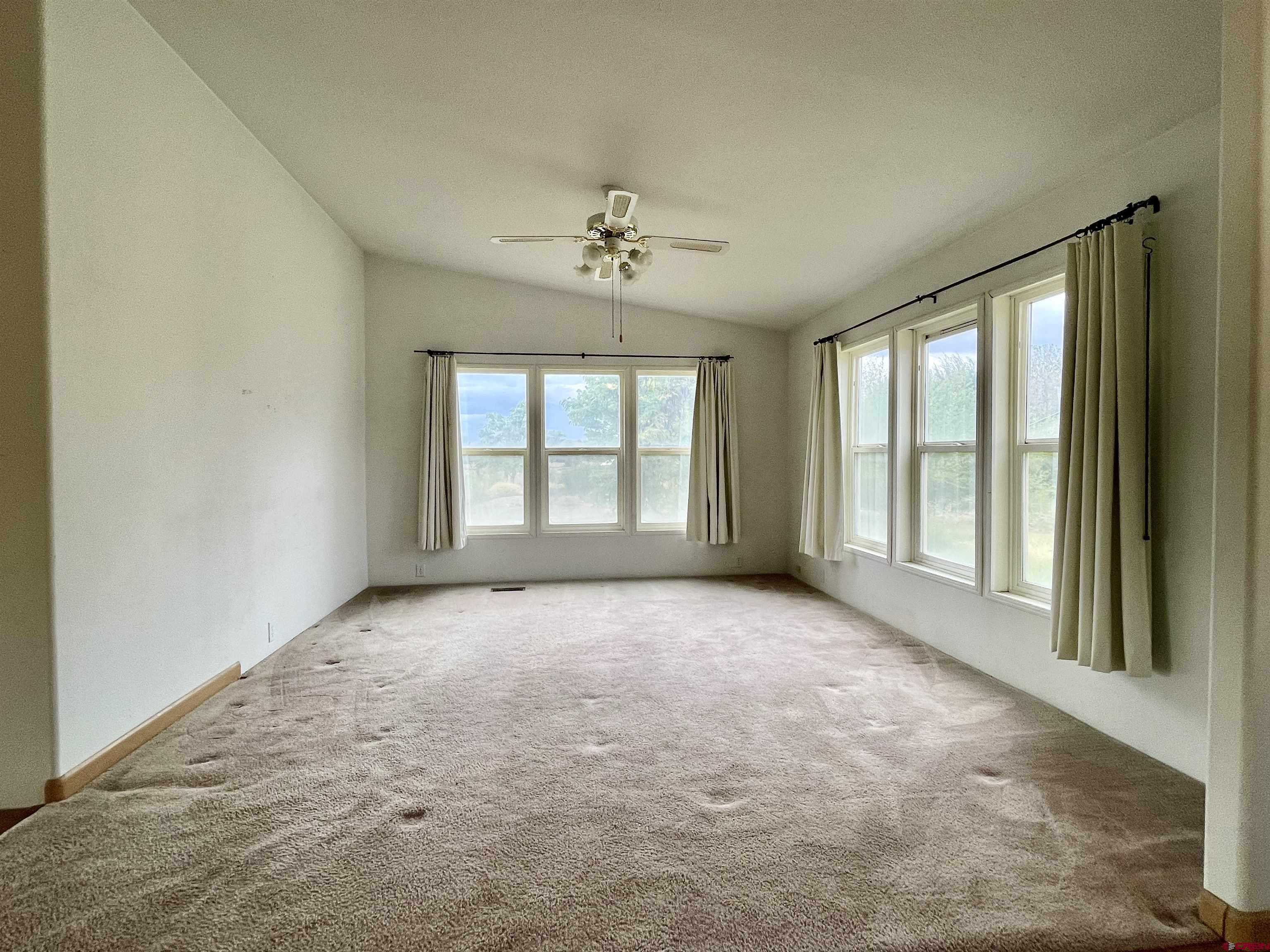 9108 1995th Road Austin, CO 81410 - Photo 8 of 35 a view of an empty room with a window