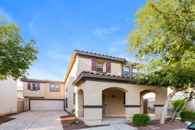 a front view of a house with garden