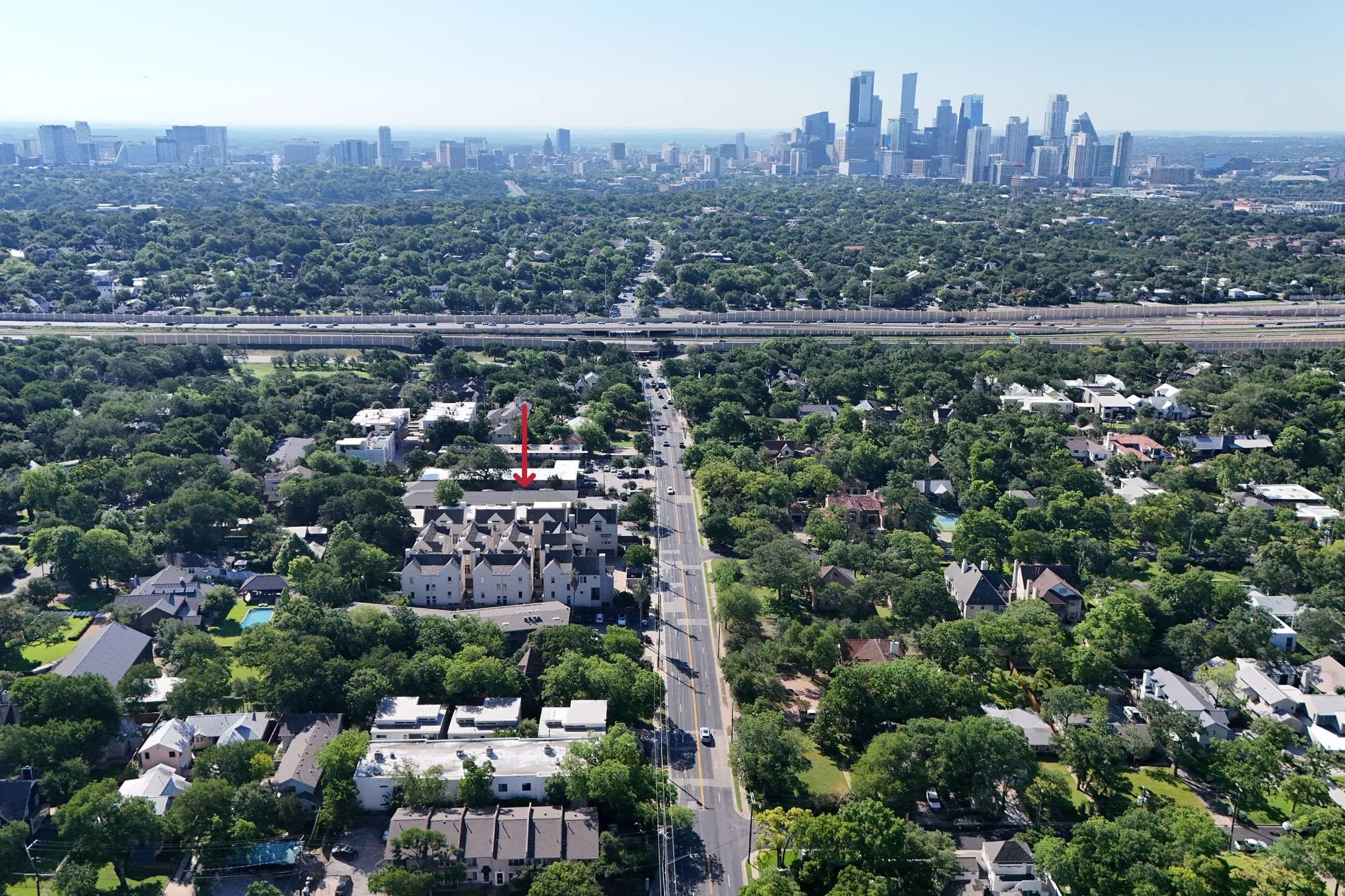 2208 Enfield Road, Unit 10500 Austin, TX 78703 - Photo 34 of 34 Aerial perspective highlighting a multi-unit property with light-toned exteriors, pitched roofs, and multiple windows