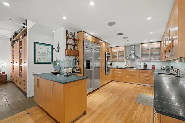 a bedroom with a bed couch and a window