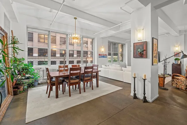 a large kitchen with stainless steel appliances granite countertop a large counter top a stove a sink and a refrigerator