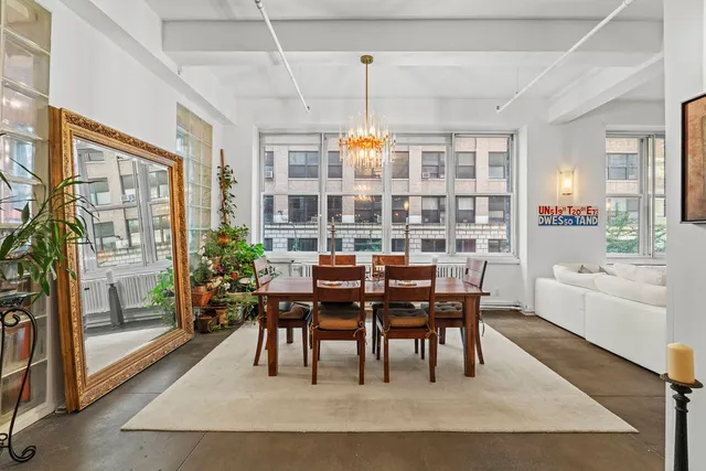 a large kitchen with stainless steel appliances kitchen island granite countertop a large counter top and a stove