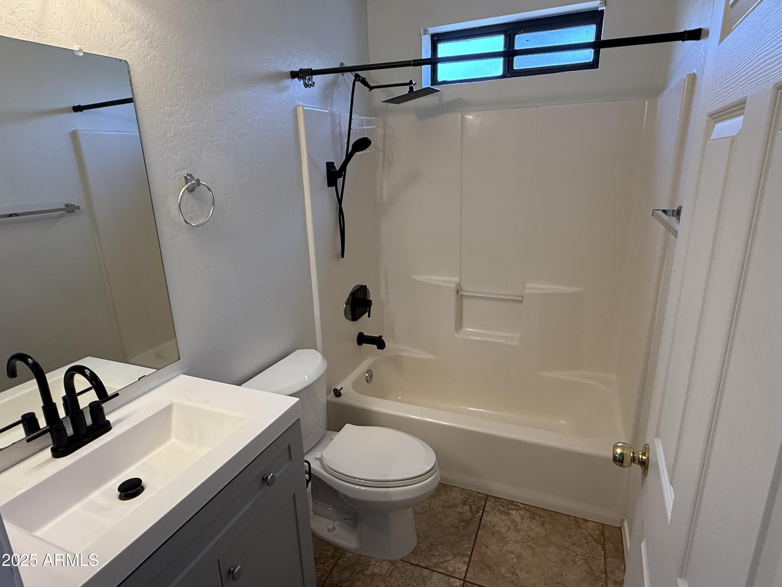 1287 North Alma School Road, Unit 260 Chandler, AZ 85224 - Photo 13 of 20 a bathroom with a sink toilet and shower