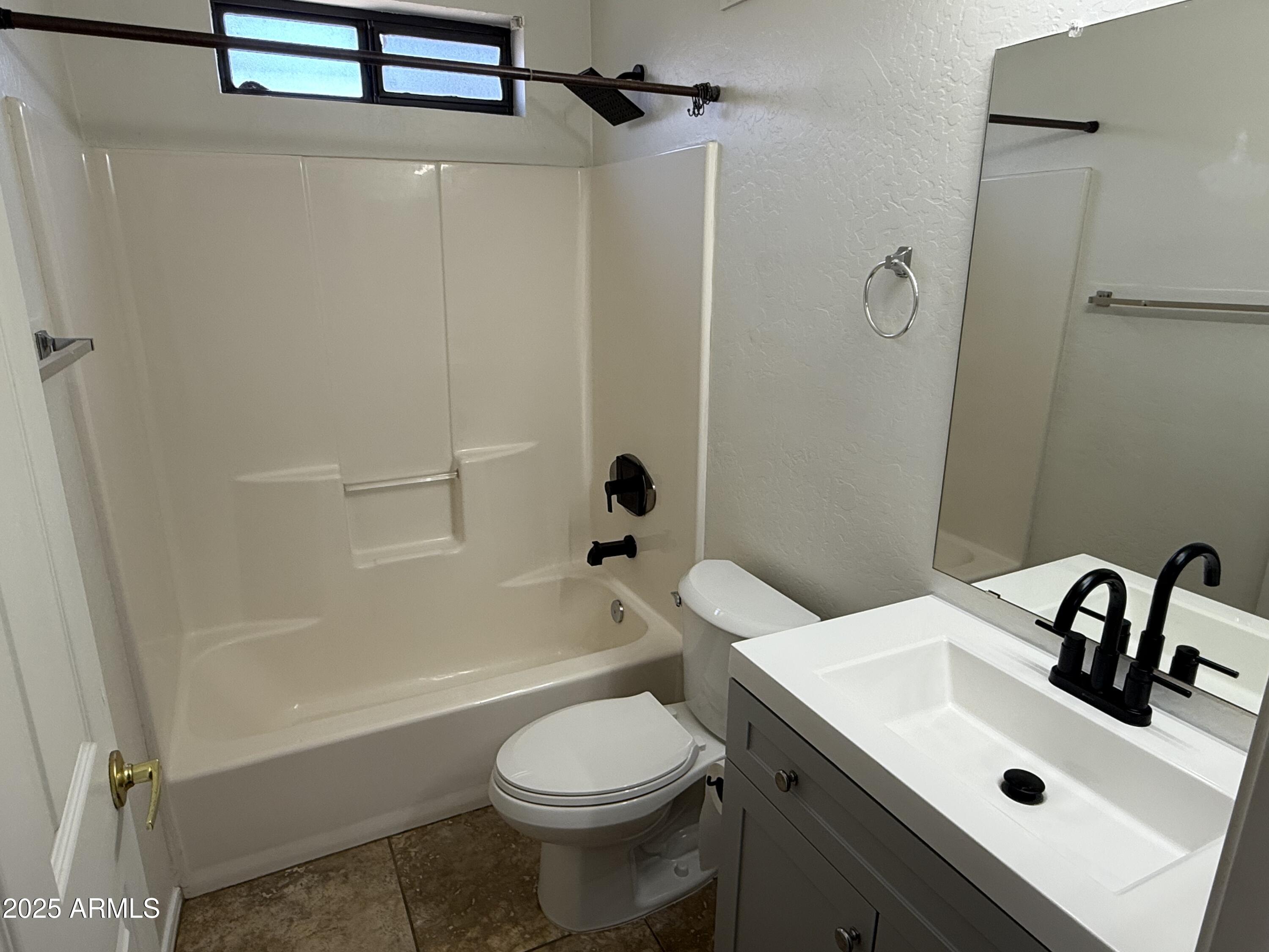 1287 North Alma School Road, Unit 260 Chandler, AZ 85224 - Photo 17 of 20 a bathroom with a sink toilet and shower