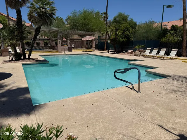 a view of a swimming pool with a patio