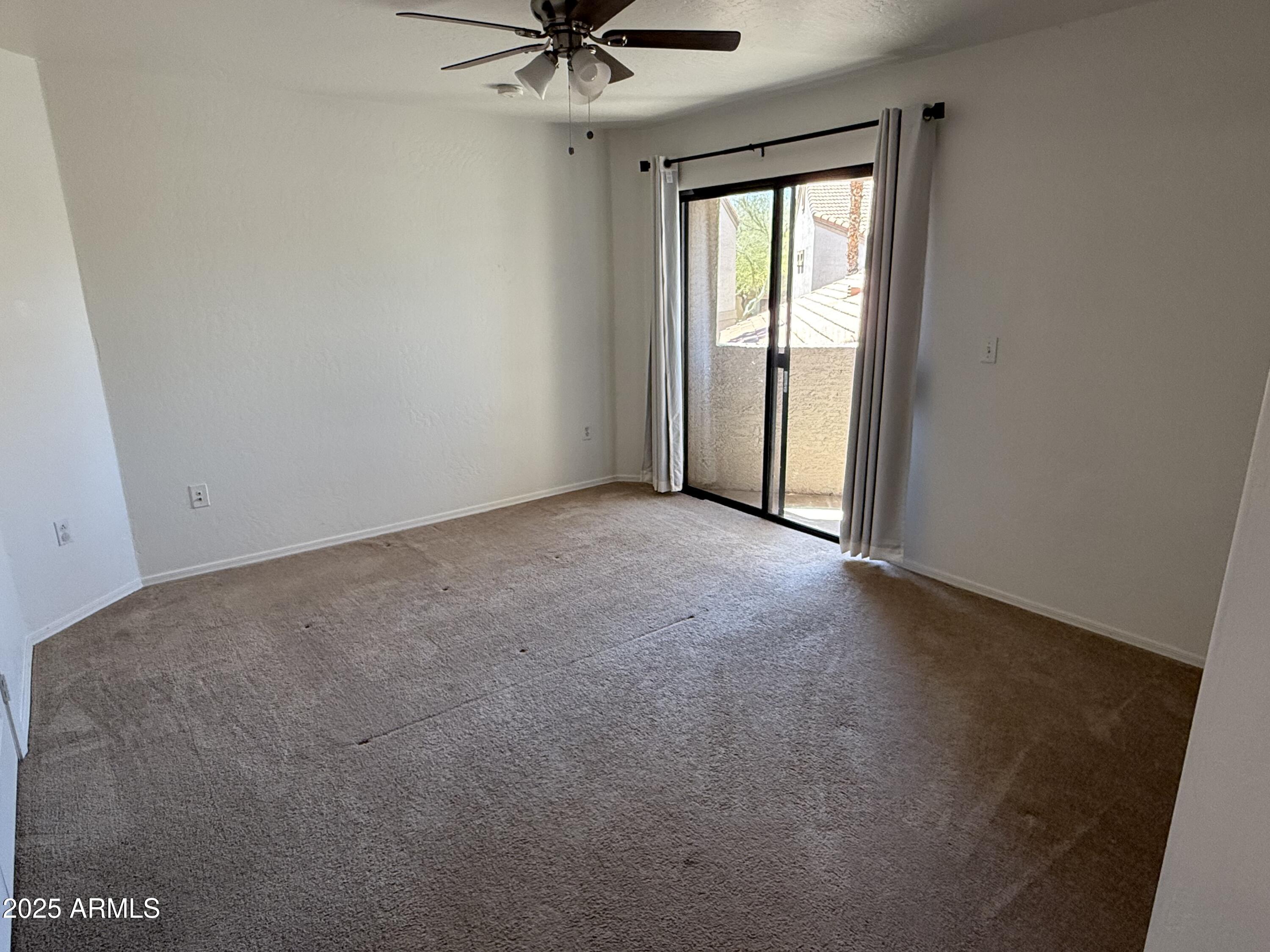 1287 North Alma School Road, Unit 260 Chandler, AZ 85224 - Photo 10 of 20 an empty room with a window