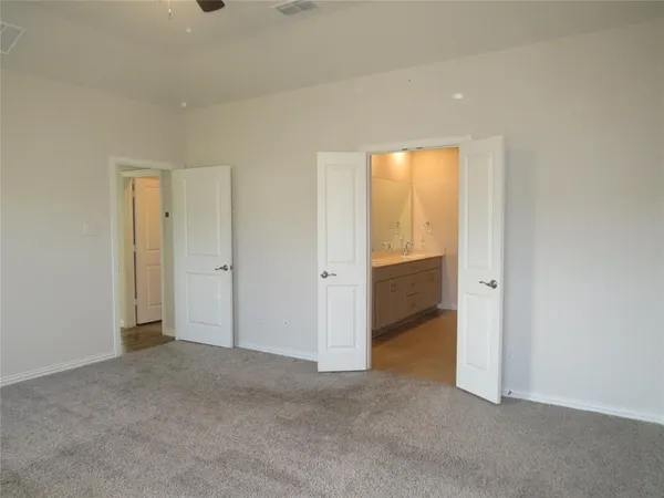 a view of an empty room and a window