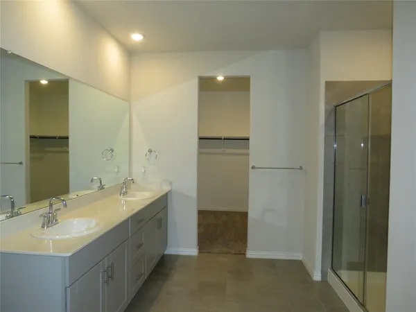 a bathroom with a double vanity sink mirror and double