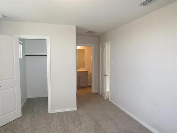 a view of an empty room and closet