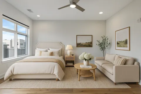 a bedroom with a bed and a couch