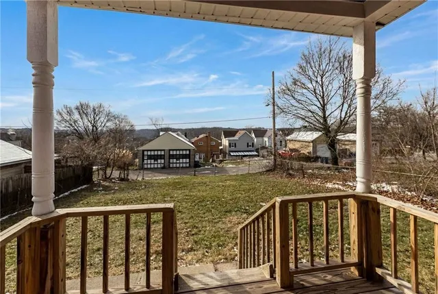 a view of a brick house with a yard