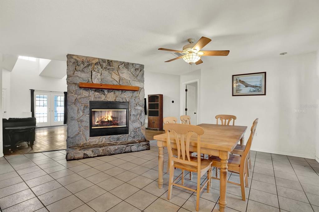 8240 Neda Street Spring Hill, FL 34606 - Photo 19 of 53 a view of a livingroom with furniture and a fireplace