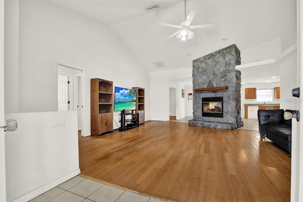 8240 Neda Street Spring Hill, FL 34606 - Photo 2 of 53 a living room with furniture and a fireplace