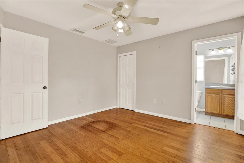 8240 Neda Street Spring Hill, FL 34606 - Photo 27 of 53 a view of empty room with wooden floor