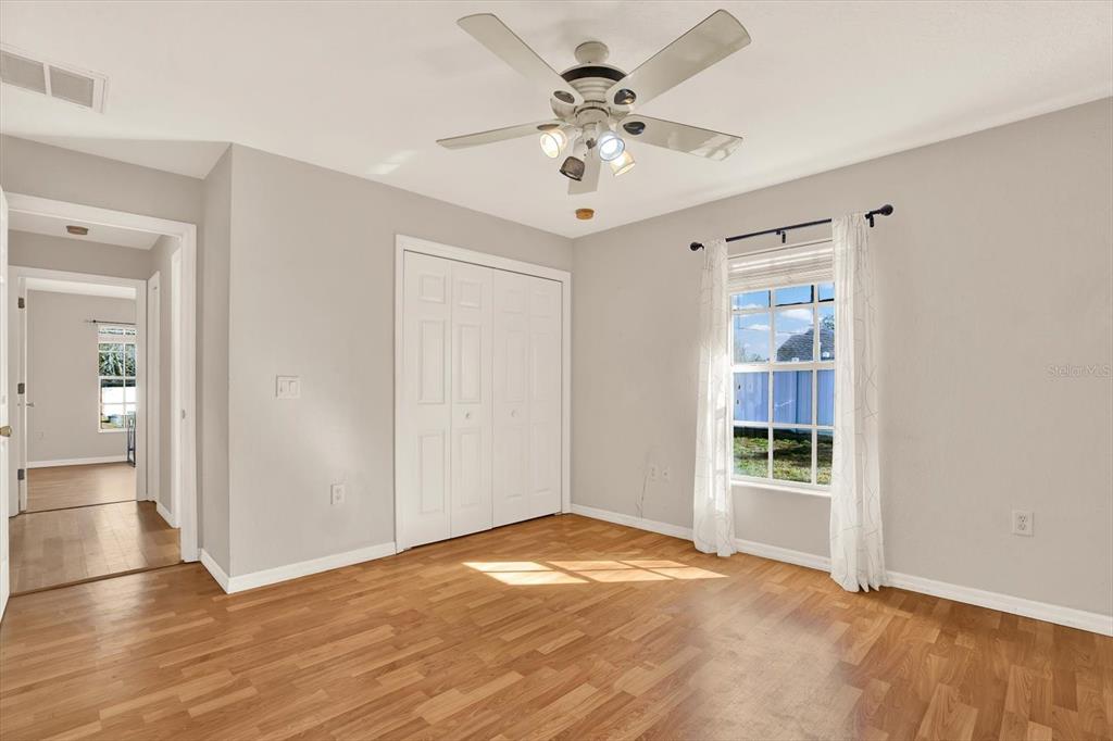 8240 Neda Street Spring Hill, FL 34606 - Photo 30 of 53 wooden floor in an empty room with a window
