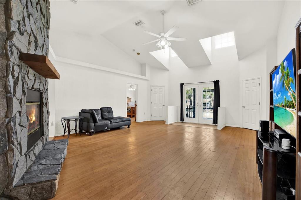 8240 Neda Street Spring Hill, FL 34606 - Photo 3 of 53 a view of a livingroom with furniture and a flat screen tv