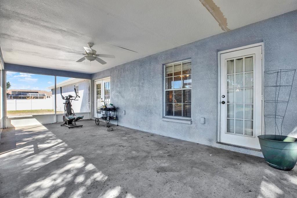 8240 Neda Street Spring Hill, FL 34606 - Photo 38 of 53 a view of a livingroom with lounge chair and windows