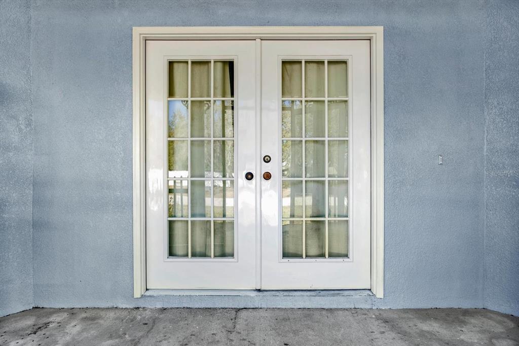 8240 Neda Street Spring Hill, FL 34606 - Photo 39 of 53 a view of a glass door