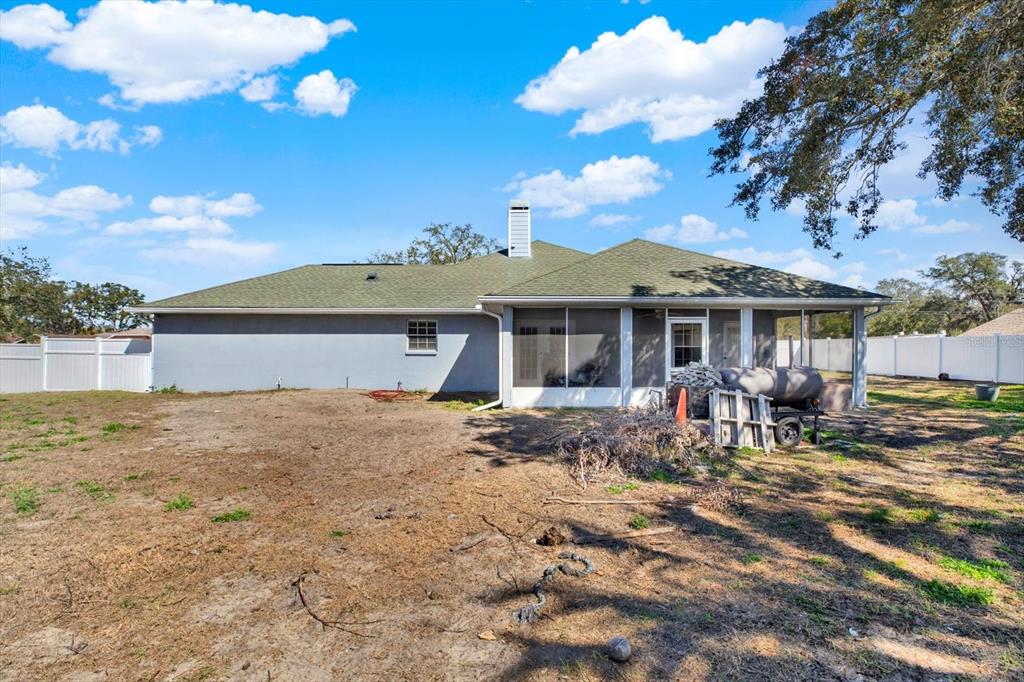 8240 Neda Street Spring Hill, FL 34606 - Photo 40 of 53 a view of a house with a patio
