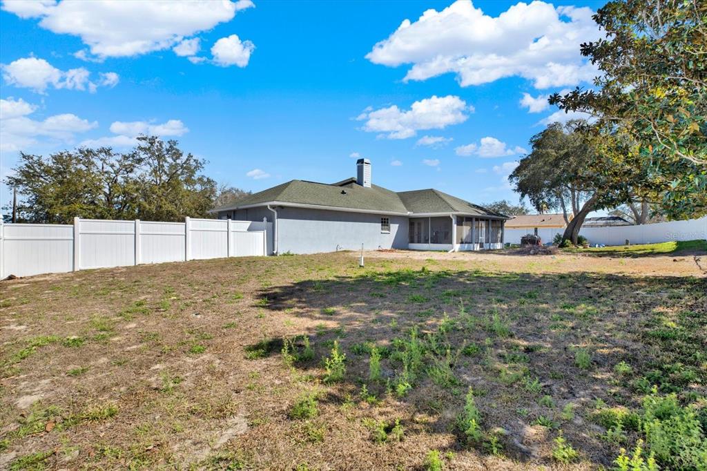 8240 Neda Street Spring Hill, FL 34606 - Photo 42 of 53 a view of a house with a yard