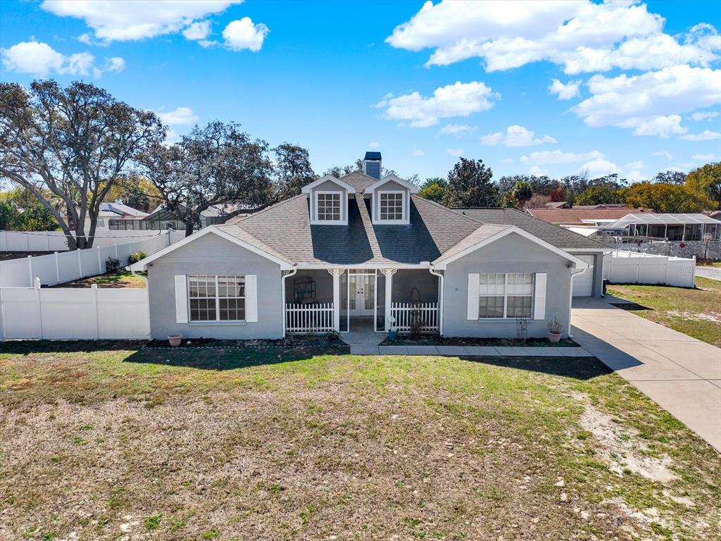 8240 Neda Street Spring Hill, FL 34606 - Photo 45 of 53 a front view of a house with a yard