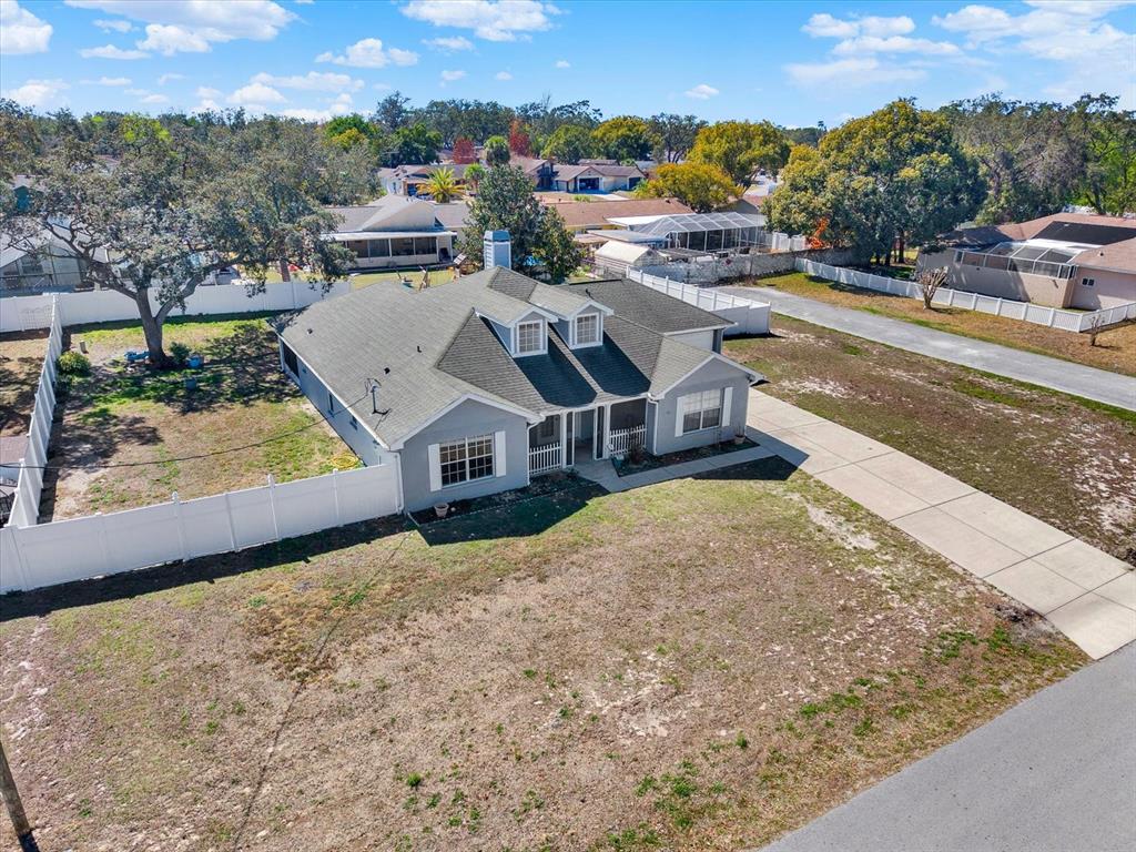 8240 Neda Street Spring Hill, FL 34606 - Photo 47 of 53 an aerial view of a house with a yard basket ball court and city view