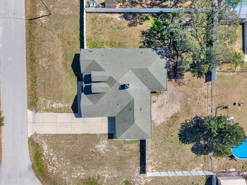 8240 Neda Street Spring Hill, FL 34606 - Photo 52 of 53 an aerial view of a house with a yard