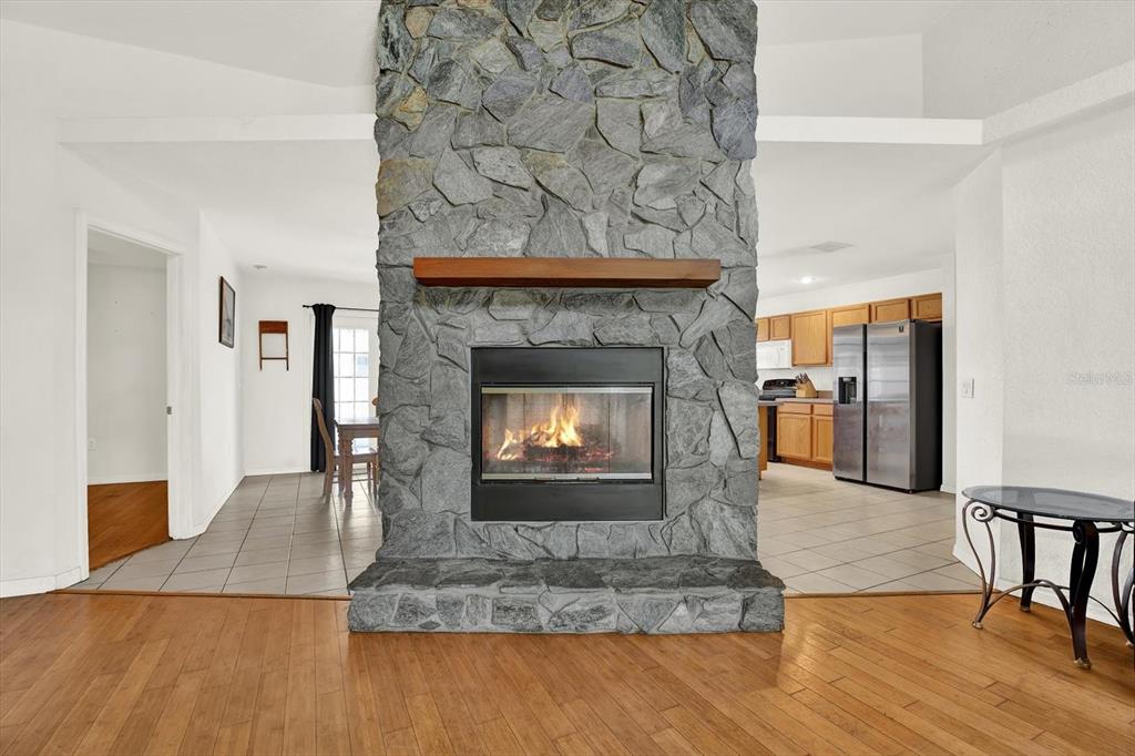 8240 Neda Street Spring Hill, FL 34606 - Photo 6 of 53 a living room with furniture and a fireplace