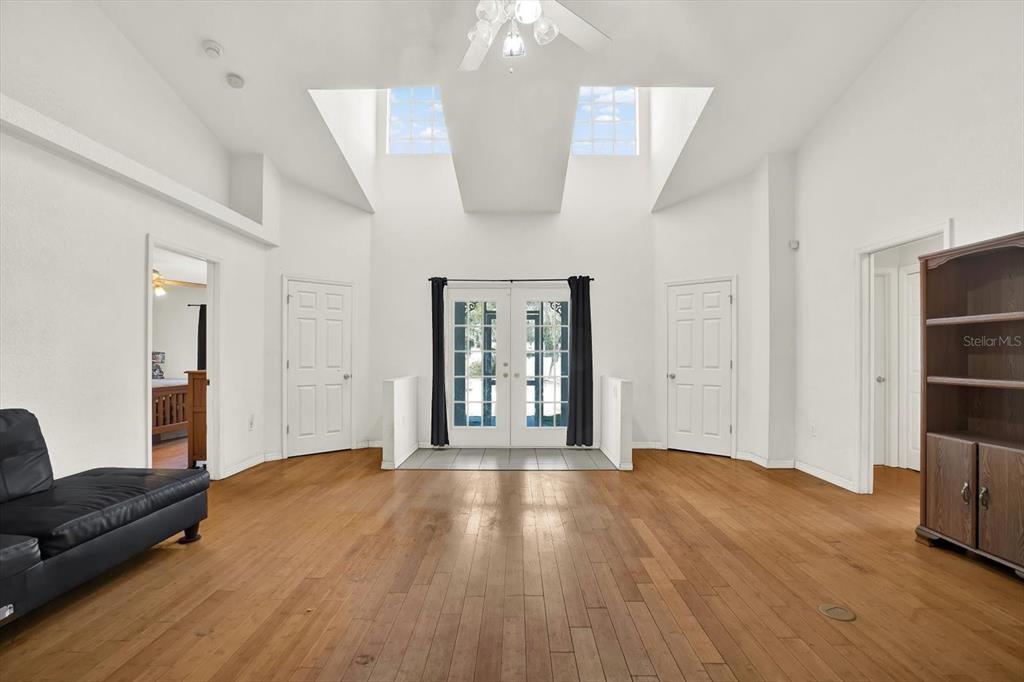 8240 Neda Street Spring Hill, FL 34606 - Photo 9 of 53 a view of livingroom with furniture and wooden floor