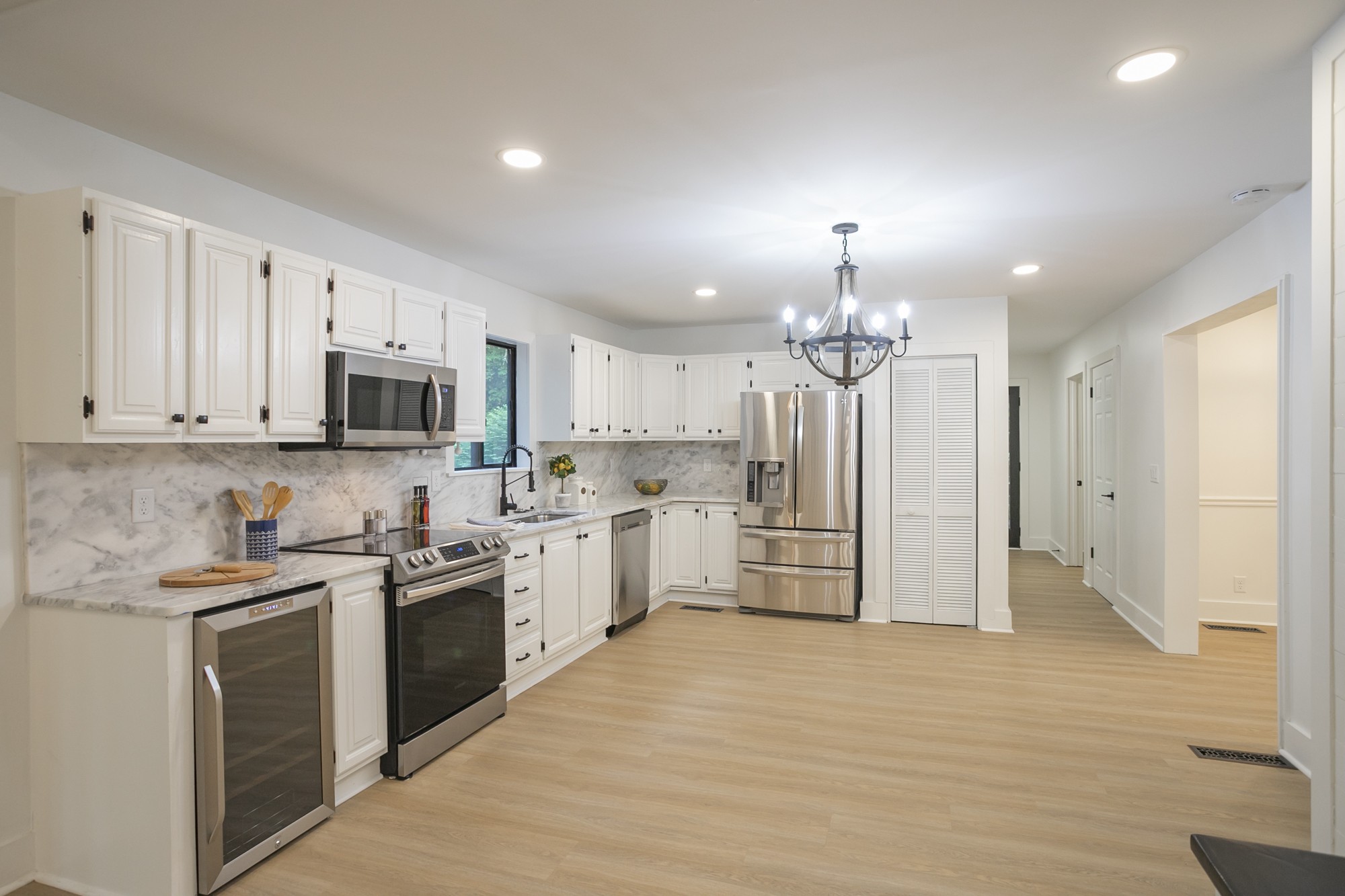 5860 Cane Ridge Road Antioch, TN 37013 - Photo 11 of 46 a kitchen with stainless steel appliances a white stove top oven cabinets a refrigerator and a sink