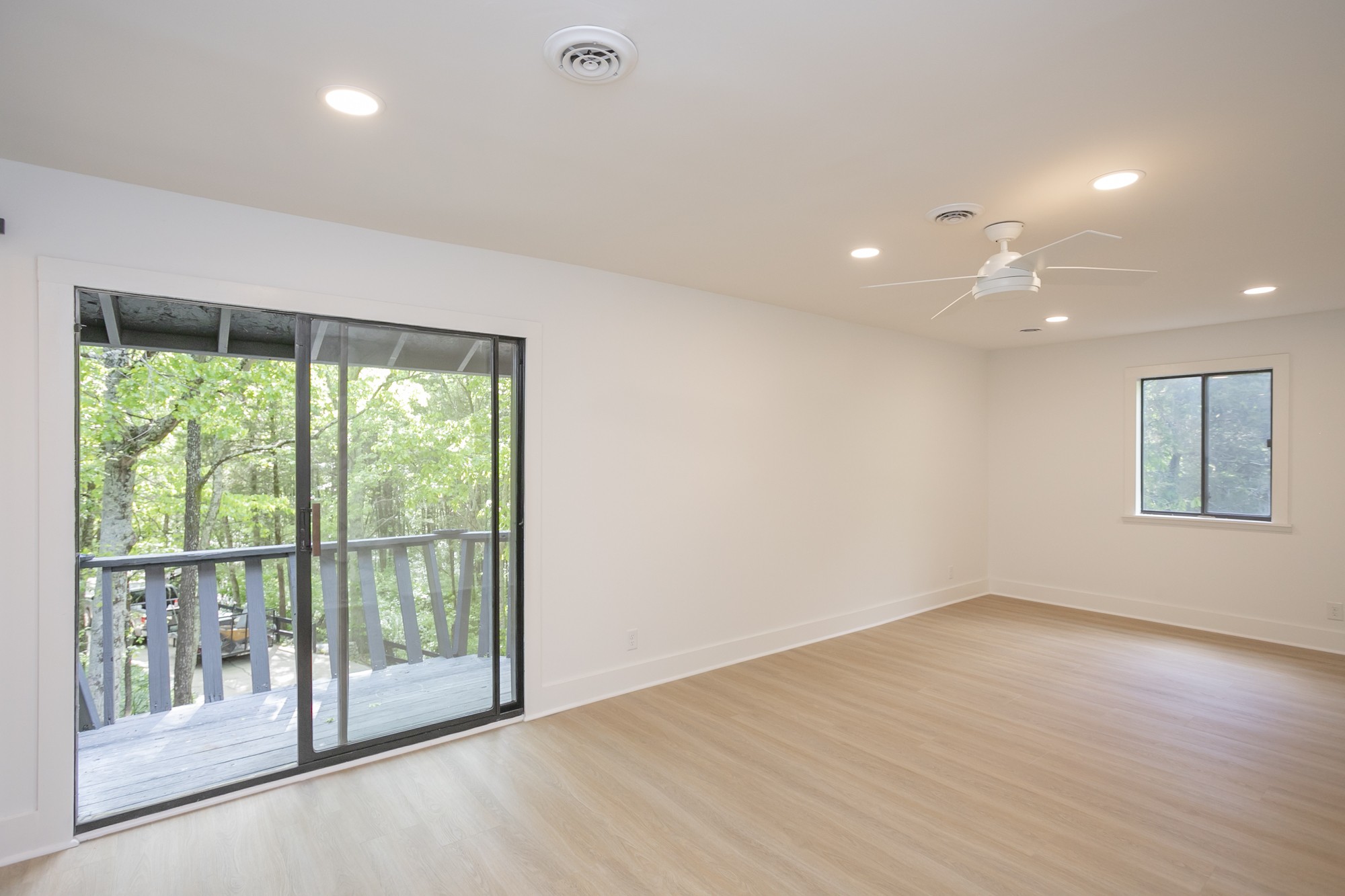 5860 Cane Ridge Road Antioch, TN 37013 - Photo 21 of 46 a view of an empty room with wooden floor and a window