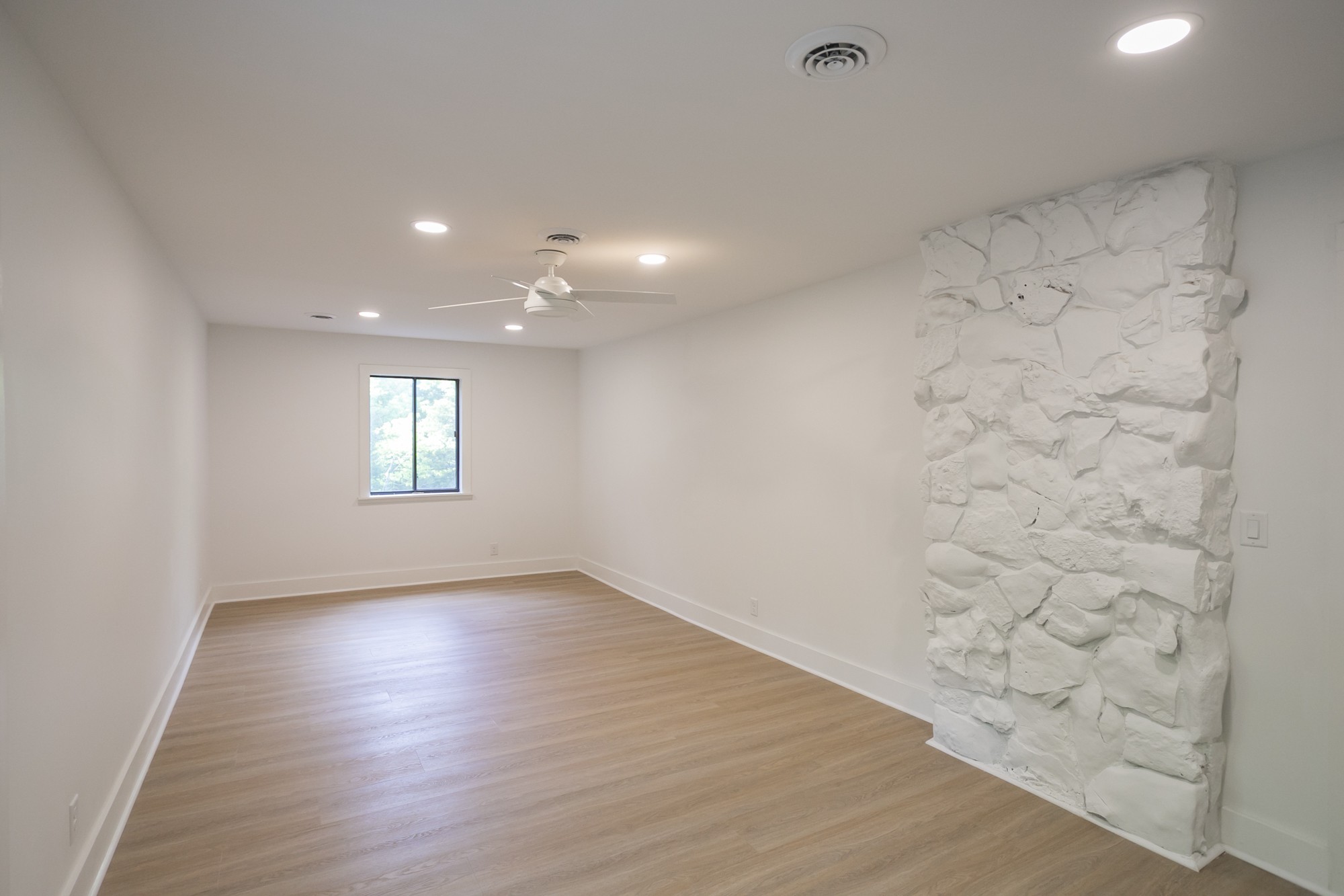 5860 Cane Ridge Road Antioch, TN 37013 - Photo 22 of 46 an empty room with wooden floor and windows