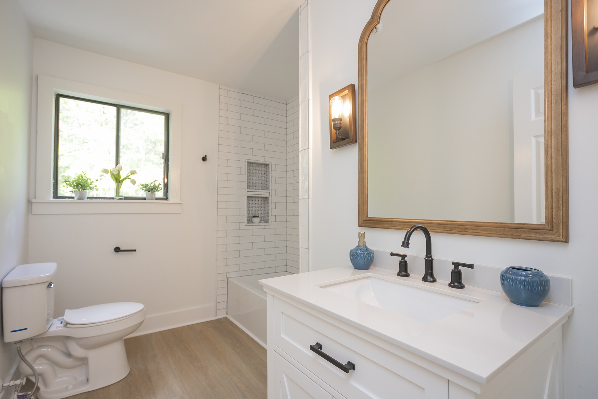 5860 Cane Ridge Road Antioch, TN 37013 - Photo 26 of 46 a bathroom with a sink a toilet and a mirror