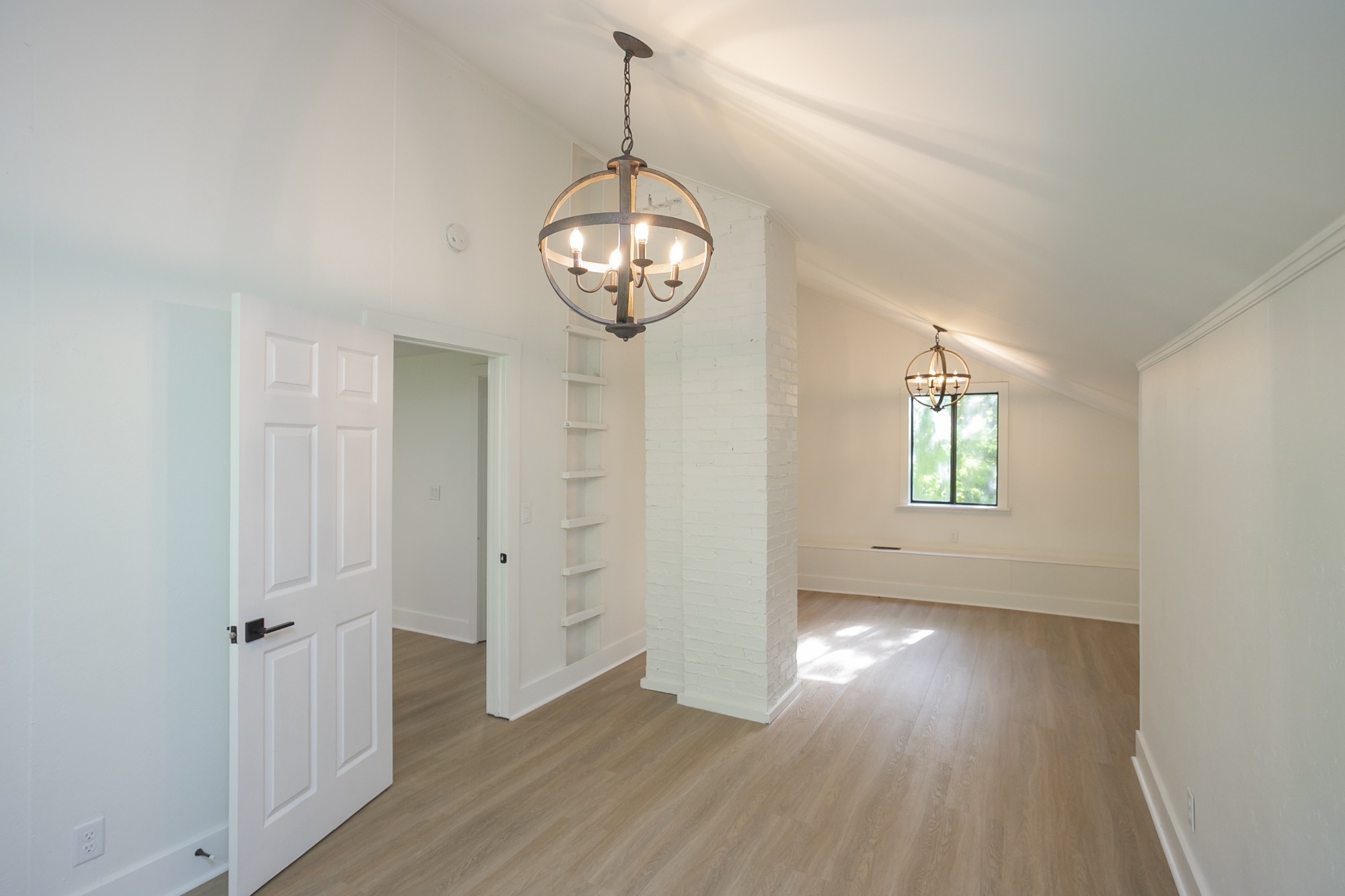 5860 Cane Ridge Road Antioch, TN 37013 - Photo 30 of 46 an empty room with wooden floor and windows
