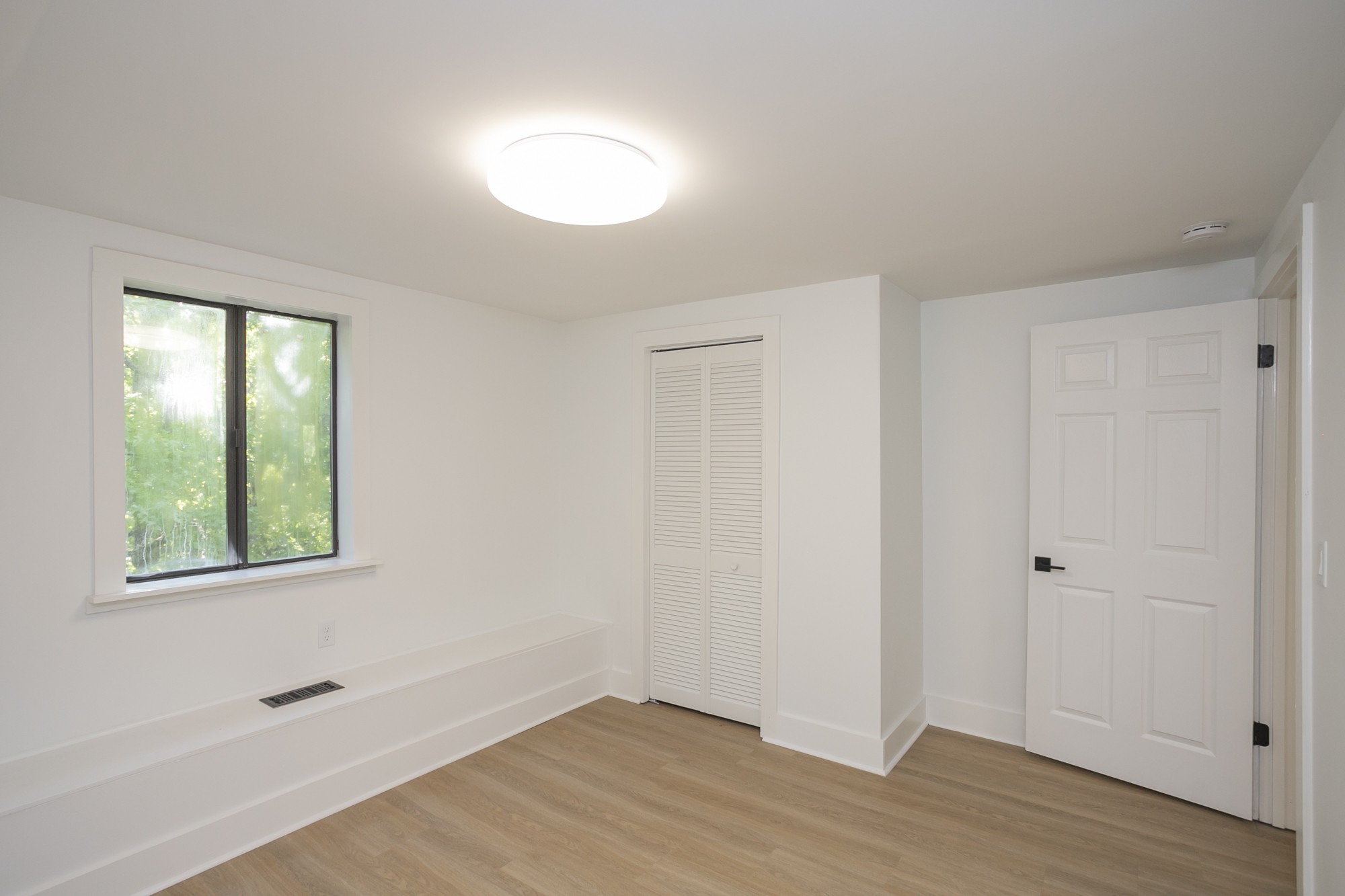 5860 Cane Ridge Road Antioch, TN 37013 - Photo 33 of 46 a view of an empty room with wooden floor and a window