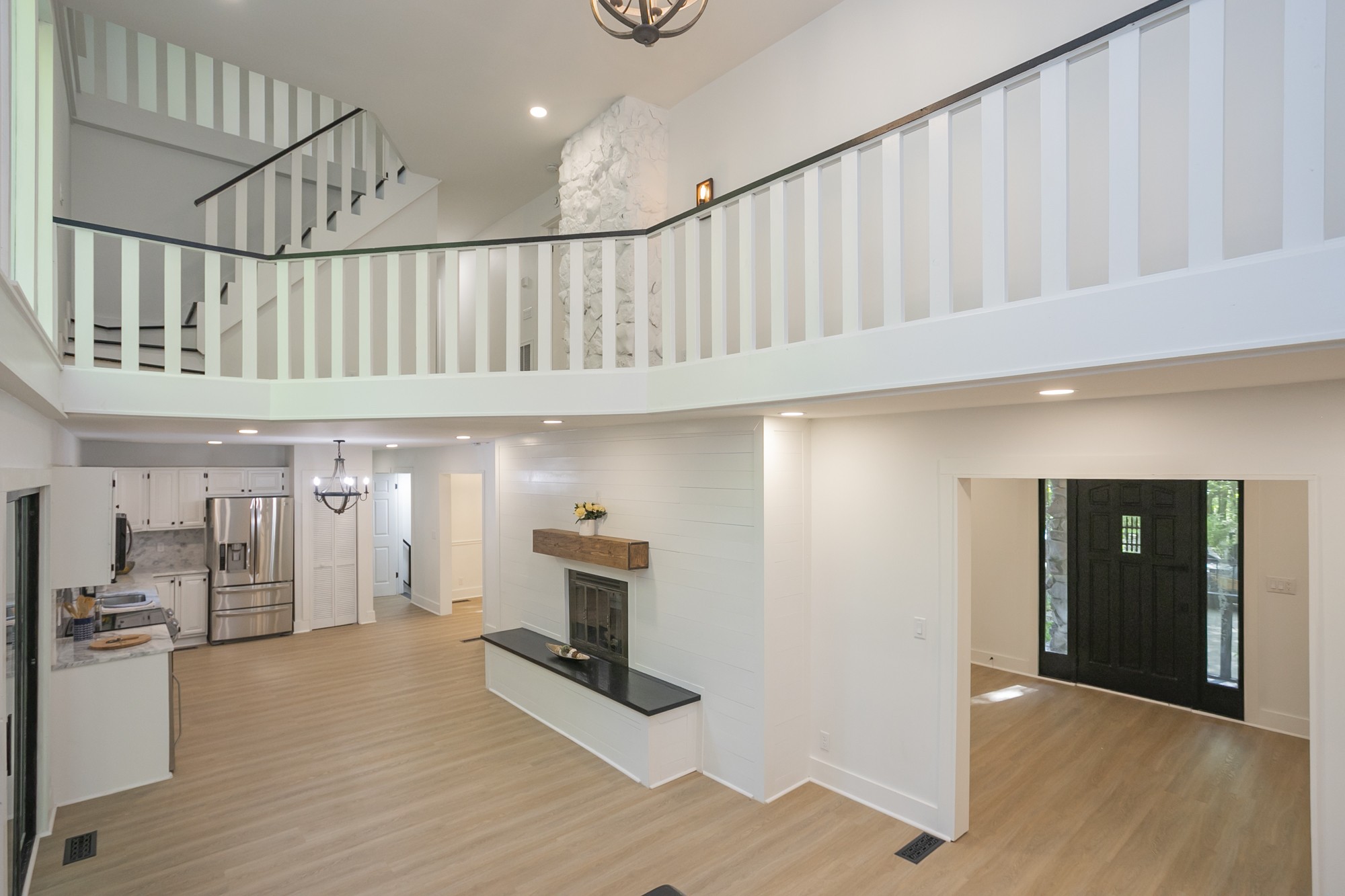 5860 Cane Ridge Road Antioch, TN 37013 - Photo 34 of 46 a view of staircase with kitchen view and wooden floor