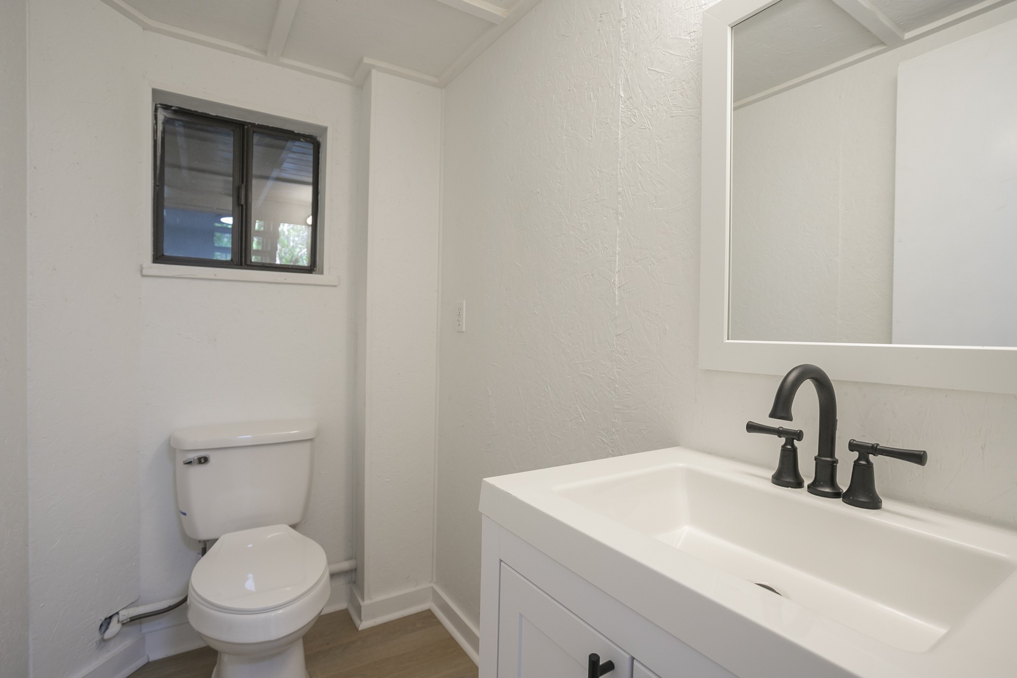 5860 Cane Ridge Road Antioch, TN 37013 - Photo 38 of 46 a bathroom with a toilet sink and mirror