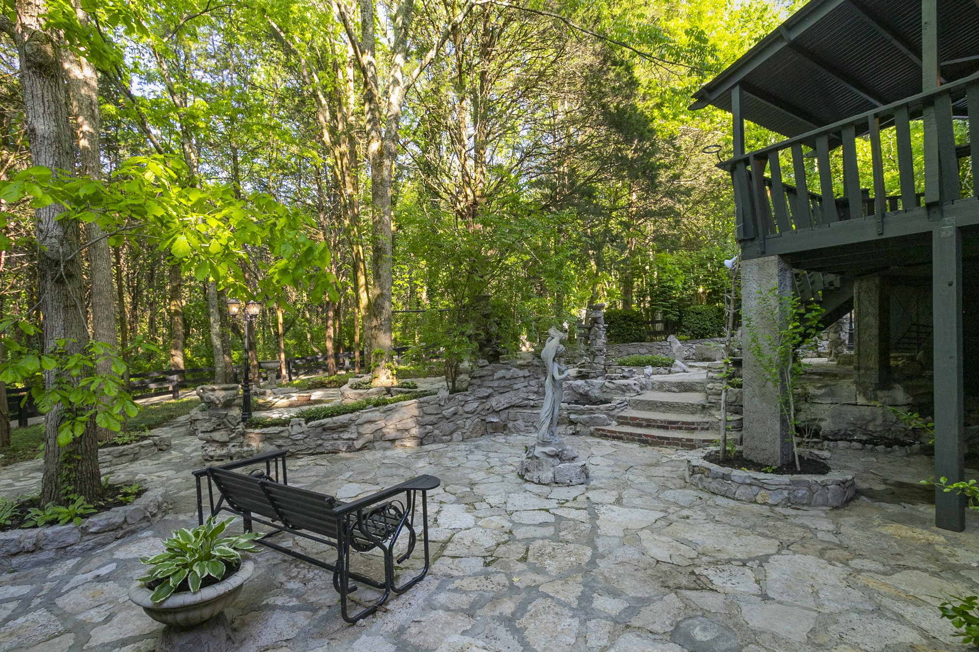 5860 Cane Ridge Road Antioch, TN 37013 - Photo 41 of 46 a backyard of a house with table and chairs