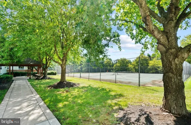 a view of a backyard with swimming pool