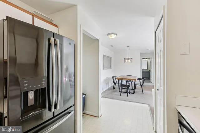 a view of a kitchen from the hallway