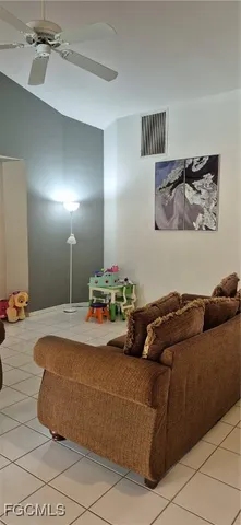 a bedroom with a bed and a mirror