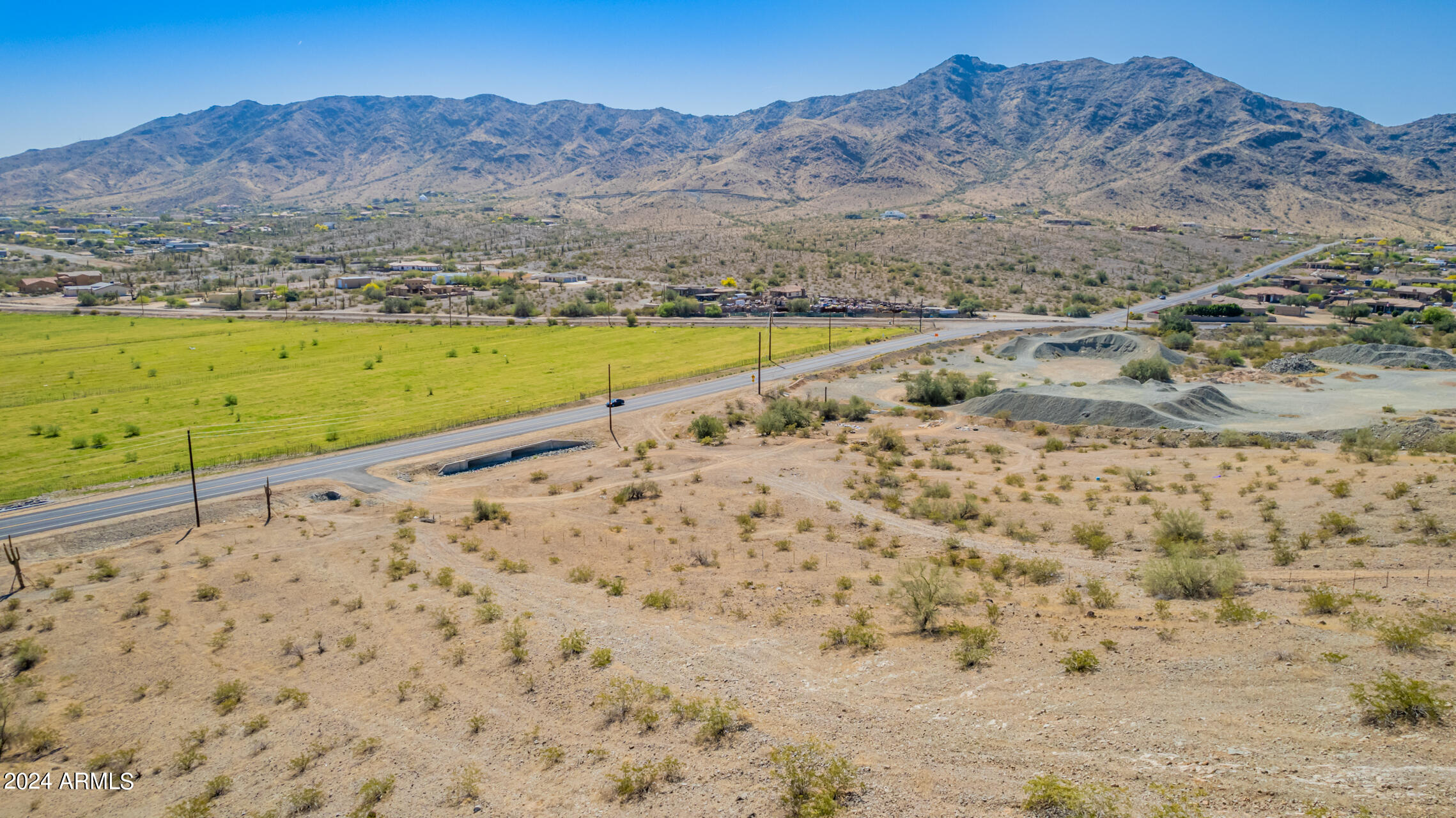10500 South 35th Avenue, Unit MB Laveen, AZ 85339 - Photo 11 of 15 a view of a field with a mountain in the background