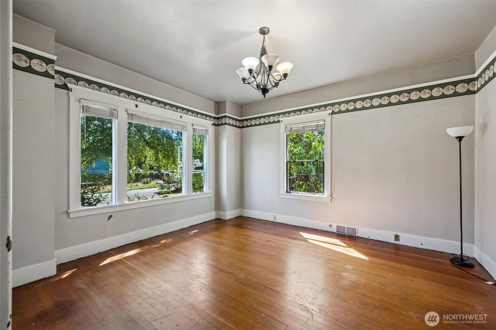 668 Northwest Folsom Street Chehalis, WA 98532 - Photo 15 of 34 a view of an empty room with a window and wooden floor