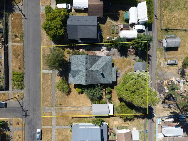 an aerial view of houses with outdoor space