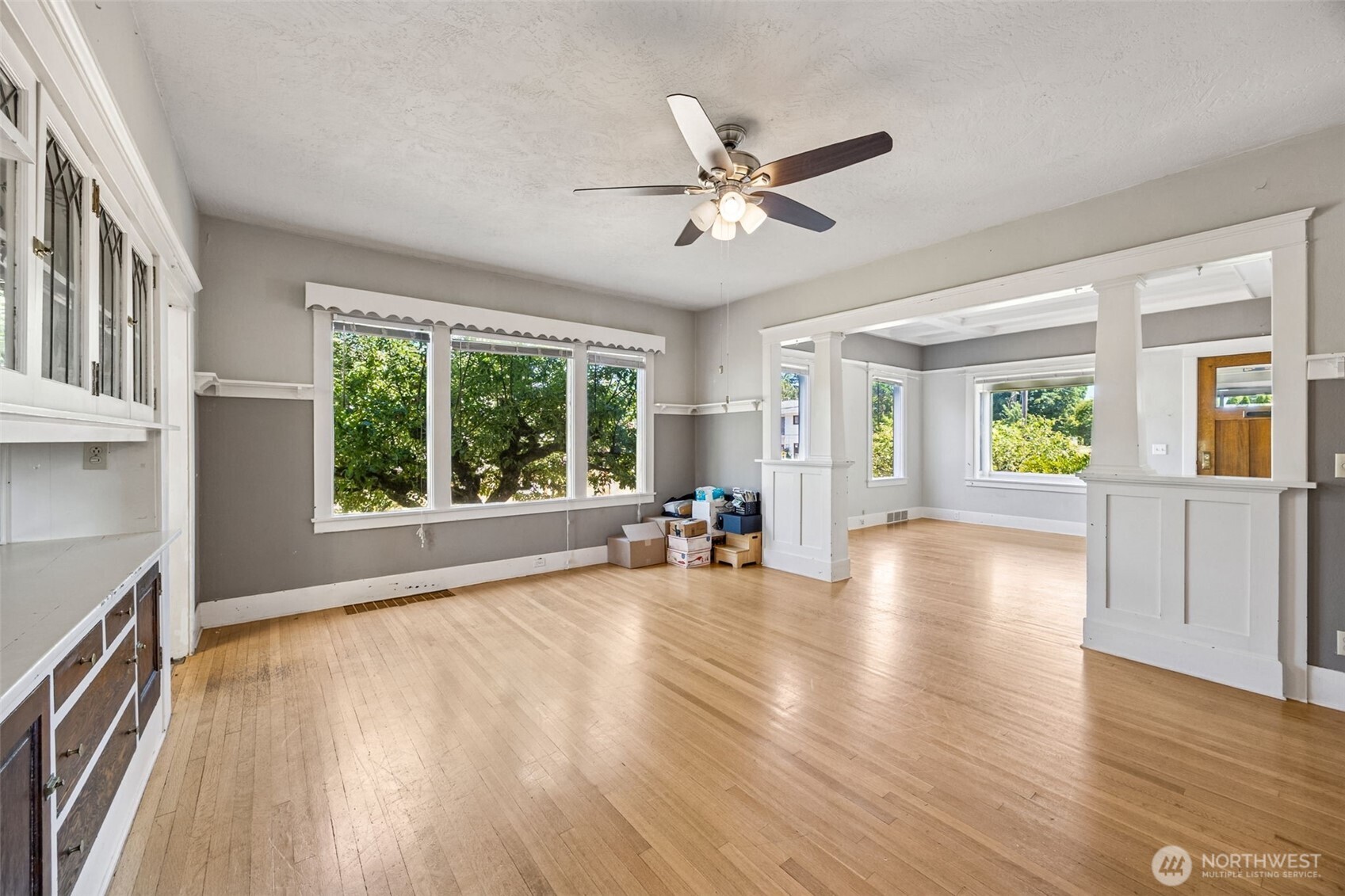 668 Northwest Folsom Street Chehalis, WA 98532 - Photo 7 of 34 a view of an empty room with a window and wooden floor