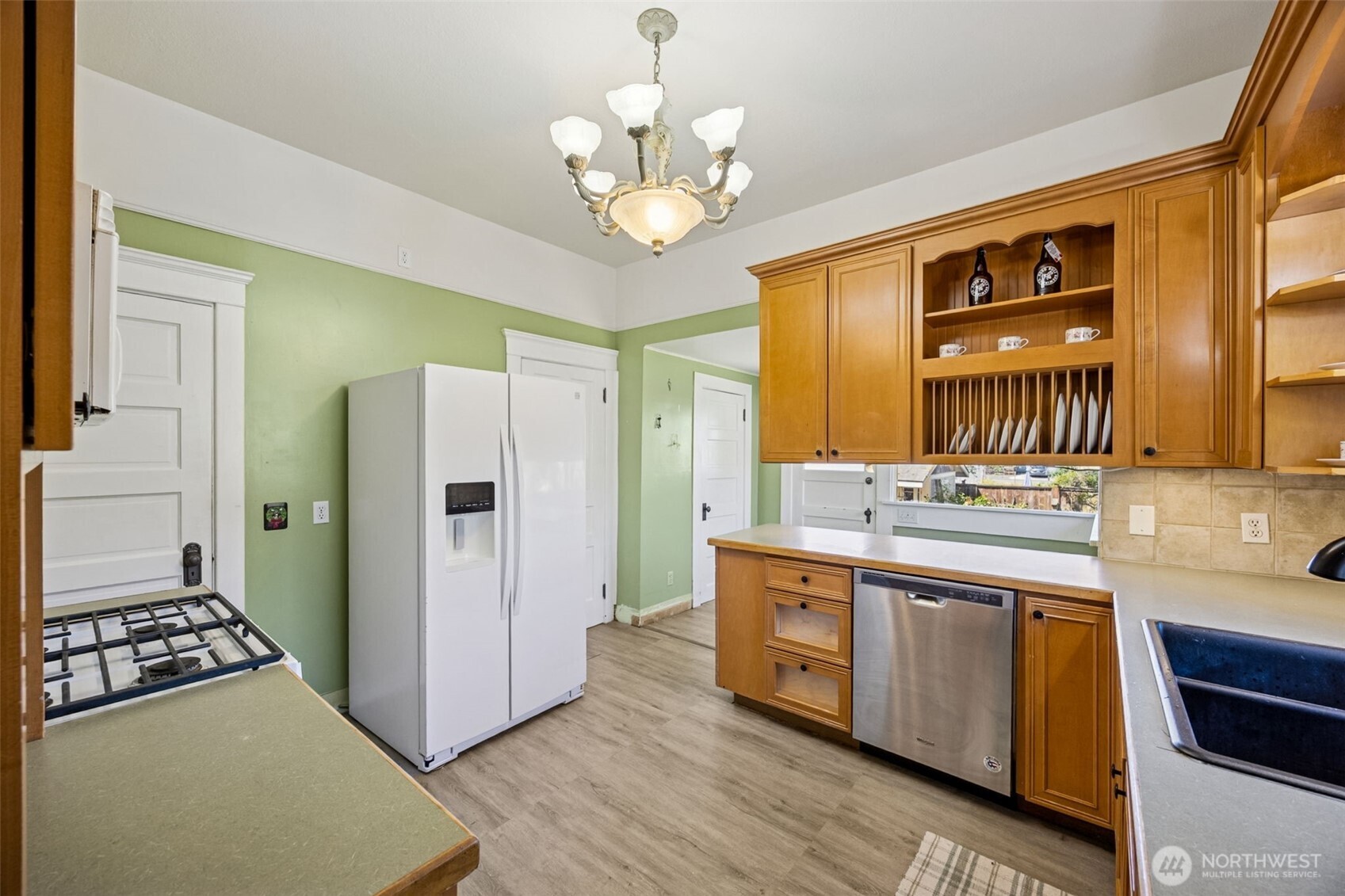 668 Northwest Folsom Street Chehalis, WA 98532 - Photo 10 of 34 a kitchen with stainless steel appliances granite countertop a refrigerator a stove and a sink