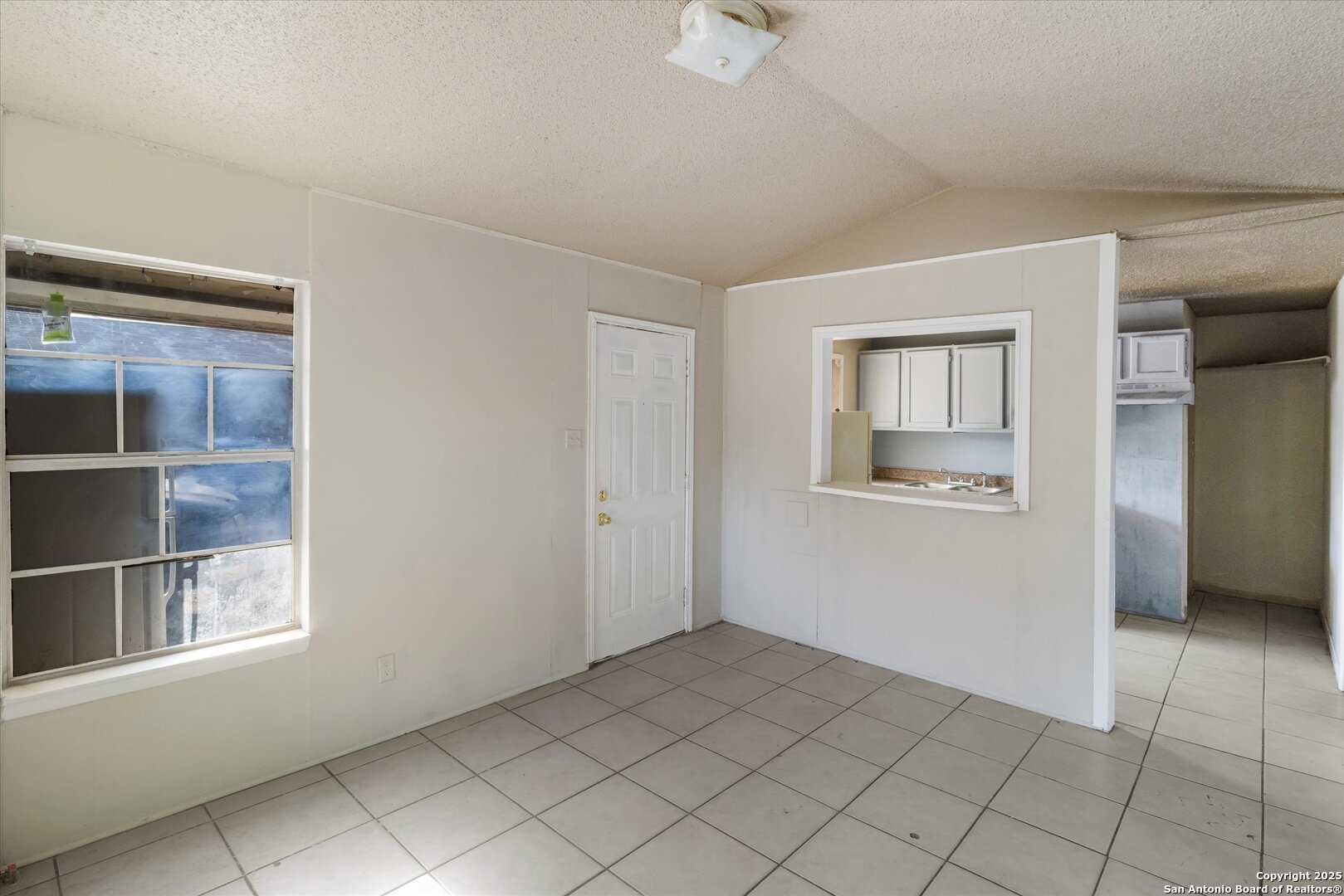 3620 Rivas Street San Antonio, TX 78228 - Photo 9 of 15 a view of an empty room with a window