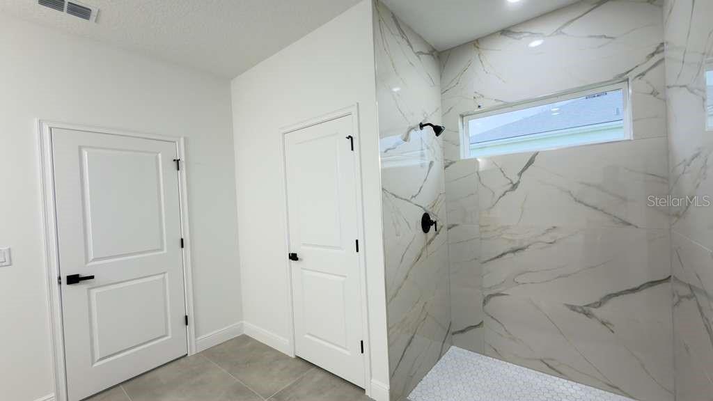 14905 Southwest 24th Circle Ocala, FL 34472 - Photo 16 of 24 a bathroom with a shower