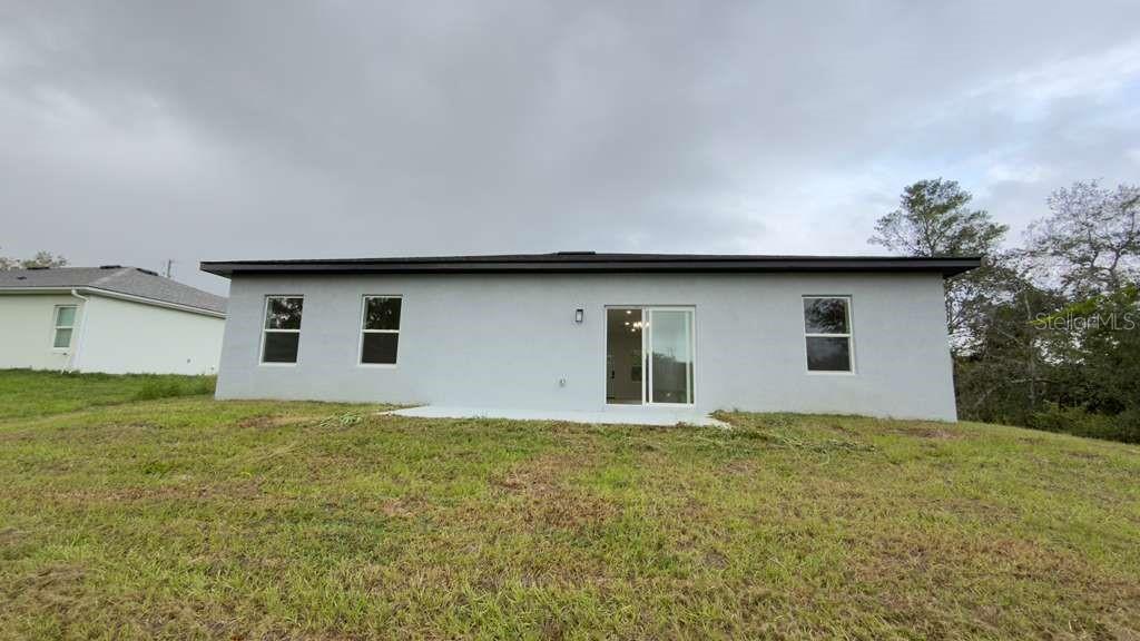 14905 Southwest 24th Circle Ocala, FL 34472 - Photo 21 of 24 a house with garden in front of it